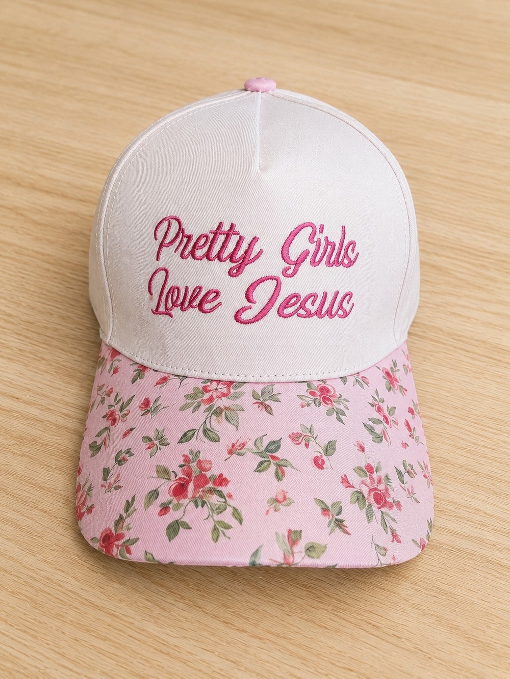 Pink floral baseball cap with "Pretty Girls Love Jesus" embroidery